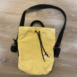 Tan utility bag with hand and shoulder straps